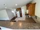 Open kitchen with a breakfast bar overlooking the living area, featuring stainless steel appliances at 11505 Sweetbriar Ridge Dr, Charlotte, NC 28269