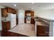 Functional kitchen with wooden cabinets, white appliances, and granite countertops, ideal for meal preparation at 11505 Sweetbriar Ridge Dr, Charlotte, NC 28269