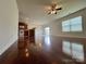 Open-concept kitchen flows into living area featuring hardwood floors and abundant natural light at 11505 Sweetbriar Ridge Dr, Charlotte, NC 28269