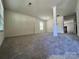 Expansive living room featuring architectural columns and a bright window at 11505 Sweetbriar Ridge Dr, Charlotte, NC 28269