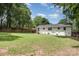 Expansive backyard featuring a well-maintained lawn and privacy fence, perfect for outdoor activities at 1218 E Woodlawn Rd, Charlotte, NC 28209