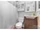 Bathroom featuring a vanity with modern sink, cabinet, and shower-tub combo at 1218 E Woodlawn Rd, Charlotte, NC 28209