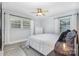 Cozy bedroom with a ceiling fan, modern lighting, and plenty of natural light at 1218 E Woodlawn Rd, Charlotte, NC 28209