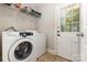 Laundry room with Samsung washer and dryer, wire shelving, and natural light at 1218 E Woodlawn Rd, Charlotte, NC 28209