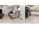 Open-concept living area with modern flooring, neutral color palette and seamlessly connected to the kitchen area at 1218 E Woodlawn Rd, Charlotte, NC 28209