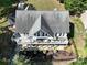 Aerial view of lake house with multiple balconies overlooking a lake at 126 Strand Rd, New London, NC 28127
