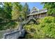 Aerial image features a multi story home with private dock access and lake views at 126 Strand Rd, New London, NC 28127