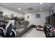 Finished basement featuring plush seating, recreational shelving, and a cozy entertainment area at 126 Strand Rd, New London, NC 28127