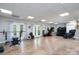 Expansive basement area with recessed lighting, French doors to the backyard, and gym equipment at 126 Strand Rd, New London, NC 28127