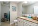 Well-lit bathroom with granite countertop vanity, tiled floor, and modern fixtures at 126 Strand Rd, New London, NC 28127