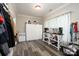 Bright bonus room featuring gray flooring, storage cabinets, and a coffee bar at 126 Strand Rd, New London, NC 28127