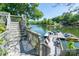 Stairway leading to a private dock on the serene lake, perfect for easy access to water activities at 126 Strand Rd, New London, NC 28127