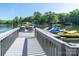Close-up of a pontoon boat and jet skis docked, showcasing waterfront fun and convenience at 126 Strand Rd, New London, NC 28127