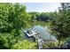 Scenic view of the lake and dock area, providing direct access to water activities and relaxation at 126 Strand Rd, New London, NC 28127