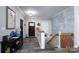 Inviting entryway with warm wood accents, stylish decor, and easy access to the staircase at 126 Strand Rd, New London, NC 28127