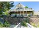 Multi-level lake house with stone foundation, balconies and a fenced-in yard at 126 Strand Rd, New London, NC 28127