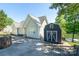 Charming home with an outbuilding, ample parking space, and serene lake views in the background at 126 Strand Rd, New London, NC 28127