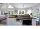 Open kitchen with granite counters, stainless appliances, and seamless flow to dining and living areas at 126 Strand Rd, New London, NC 28127