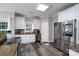 Modern kitchen featuring white cabinetry, stainless steel appliances, and sleek countertops at 126 Strand Rd, New London, NC 28127
