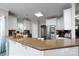 Spacious kitchen featuring stainless steel appliances, granite countertops, and a breakfast bar at 126 Strand Rd, New London, NC 28127
