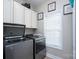 Well-lit laundry room with modern washer and dryer units, offering convenience and efficiency at 126 Strand Rd, New London, NC 28127
