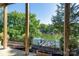Covered patio featuring tranquil lake views at 126 Strand Rd, New London, NC 28127