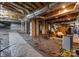 Spacious unfinished basement with concrete block pillars and plastic liner at 12835 Ninebark Trl, Charlotte, NC 28278