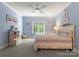Light blue bedroom with a full bed, plush carpet, large window, and ample natural light at 12835 Ninebark Trl, Charlotte, NC 28278