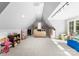 Bright bonus room with neutral walls, a vaulted ceiling, carpeted floor, and window at 12835 Ninebark Trl, Charlotte, NC 28278
