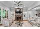 Inviting living room showcasing a stone fireplace, built-in shelving, and stylish furnishings at 12835 Ninebark Trl, Charlotte, NC 28278