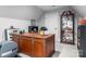 Home office features an ornate wooden desk, carpeted floors, and a decorative display cabinet at 12835 Ninebark Trl, Charlotte, NC 28278