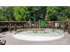 A fun splash pad area with water features for , surrounded by a wooden pergola and lush greenery at 12835 Ninebark Trl, Charlotte, NC 28278