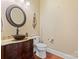 Charming bathroom with hardwood floors and a decorative sink at 1400 Delaney Dr, Matthews, NC 28104