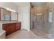 Modern bathroom showcasing a glass shower and granite countertops on the vanity with tile flooring at 1400 Delaney Dr, Matthews, NC 28104