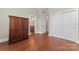 Bedroom features hardwood flooring and access to an en suite bathroom and closet at 1400 Delaney Dr, Matthews, NC 28104