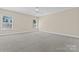 Bedroom filled with natural light features neutral walls and carpeted floors at 1400 Delaney Dr, Matthews, NC 28104