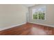 Bright bedroom features wood flooring, large window providing natural light at 1400 Delaney Dr, Matthews, NC 28104
