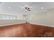 Spacious bonus room featuring hardwood floors, neutral paint, and natural light perfect for entertaining at 1400 Delaney Dr, Matthews, NC 28104