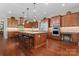 Gourmet kitchen features stainless steel appliances, custom cabinetry, central island with barstool seating at 1400 Delaney Dr, Matthews, NC 28104