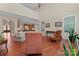 Open-concept living room showcasing high ceilings, hardwood floors, and seamless flow to kitchen at 1400 Delaney Dr, Matthews, NC 28104