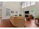 Bright living room with fireplace and large windows, offering a cozy yet elegant space at 1400 Delaney Dr, Matthews, NC 28104