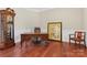 Office with hardwood floors, classic wainscoting, neutral paint, a large desk and natural light at 1400 Delaney Dr, Matthews, NC 28104