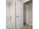 Bathroom featuring a shower-tub combo and doorways at 14010 Pinyon Pine Ln, Charlotte, NC 28215