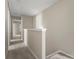 Hallway with soft carpet that leads to other rooms, making it a smooth transition between spaces at 14010 Pinyon Pine Ln, Charlotte, NC 28215