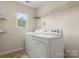 A laundry room featuring a washer and dryer at 14010 Pinyon Pine Ln, Charlotte, NC 28215
