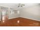 Hardwood floors connecting the kitchen and living spaces at 14010 Pinyon Pine Ln, Charlotte, NC 28215