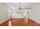 Inviting living room with hardwood floors and views into other rooms at 14010 Pinyon Pine Ln, Charlotte, NC 28215