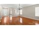Open living room featuring hardwood floors and lots of natural light at 14010 Pinyon Pine Ln, Charlotte, NC 28215