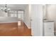Spacious living room with hardwood floors, half bath, and recessed lighting at 14010 Pinyon Pine Ln, Charlotte, NC 28215