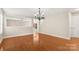 Open-concept living room boasting hardwood floors and natural light at 14010 Pinyon Pine Ln, Charlotte, NC 28215
